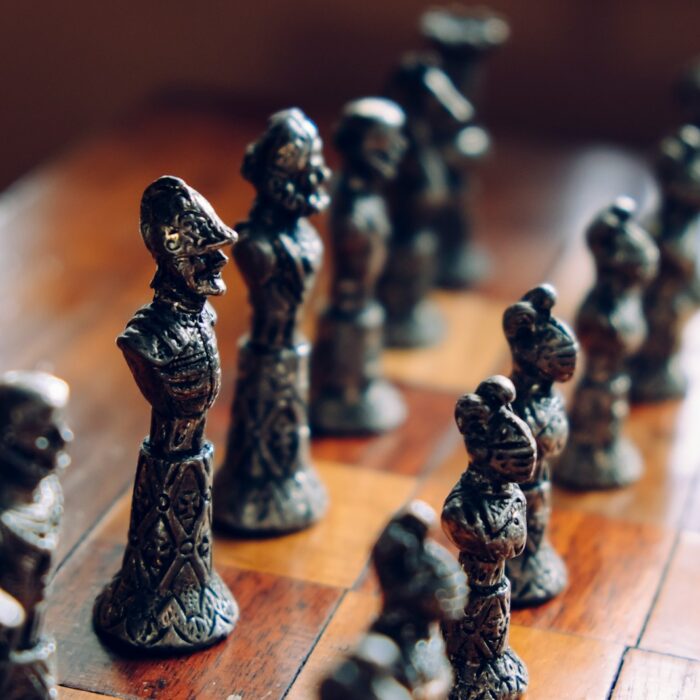 chess pieces on wooden chess board